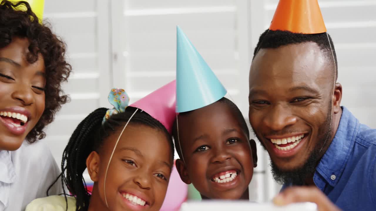Family taking selfie at birthday party