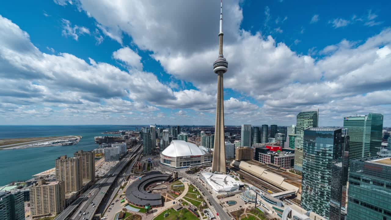Toronto, Ontario, Canada, panoramic time lapse sequence showing Toronto skyline on a sunny day, zoom out, establishing shot