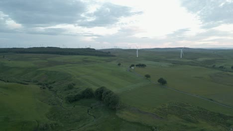 Flyover-hazy-green-Scottish-moor-to-turbines-at-Whitelee-Wind-farm