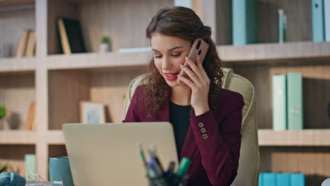 woman professional talking smartphone in office room closeup. smiling lawyer