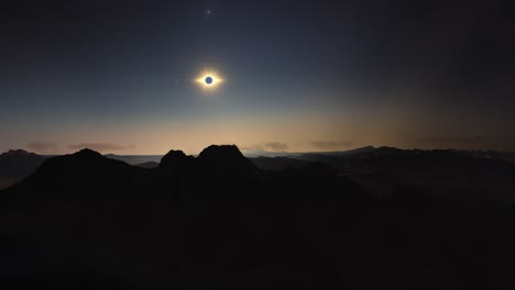 Timelapse-movement-above-mountains-at-solar-eclipse-totality-moment