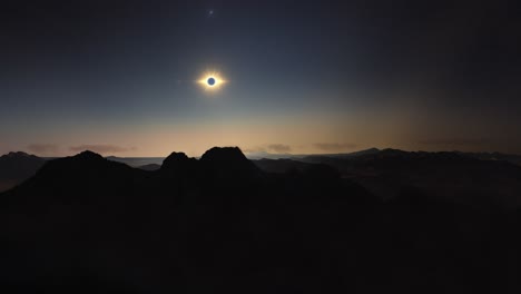 timelapse movement above mountains at solar eclipse totality moment