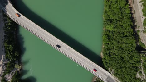 bridge on the neretva river in bosnia city from above, vehicles crossing the bridge