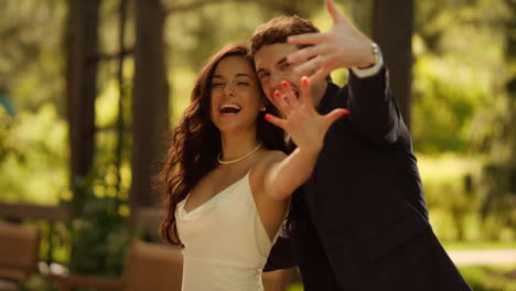 newlywed couple celebrating wedding outdoors