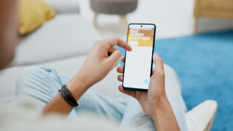 Man,-hands-and-phone-travel-website-on-sofa