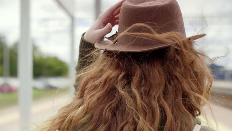 Young-woman-looking-back-in-the-city