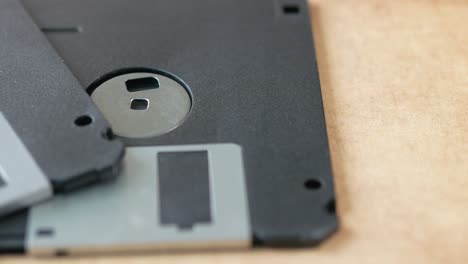 An old vintage floppy disk on a gray background