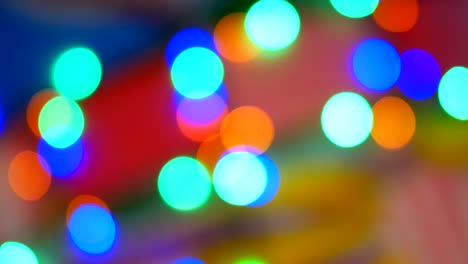 blurred colorful lights. red, green, yellow, orange, blue defocused glittering bokeh festive background. abstract multicolored light.