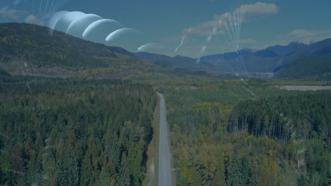 Animation of curved light beams and abstract shapes over scenic forest landscape