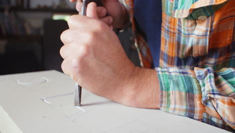 Slow-Motion-Shot-Of-Stone-Mason-At-Work-On-Carving-In-Studio