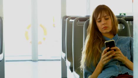 woman using mobile phone while travelling in ferry 4k