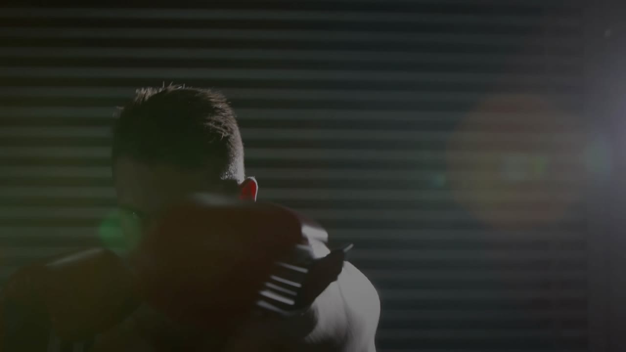Male boxer shifting weight, throwing controlled jabs and crosses for fitness, red gloves flaring