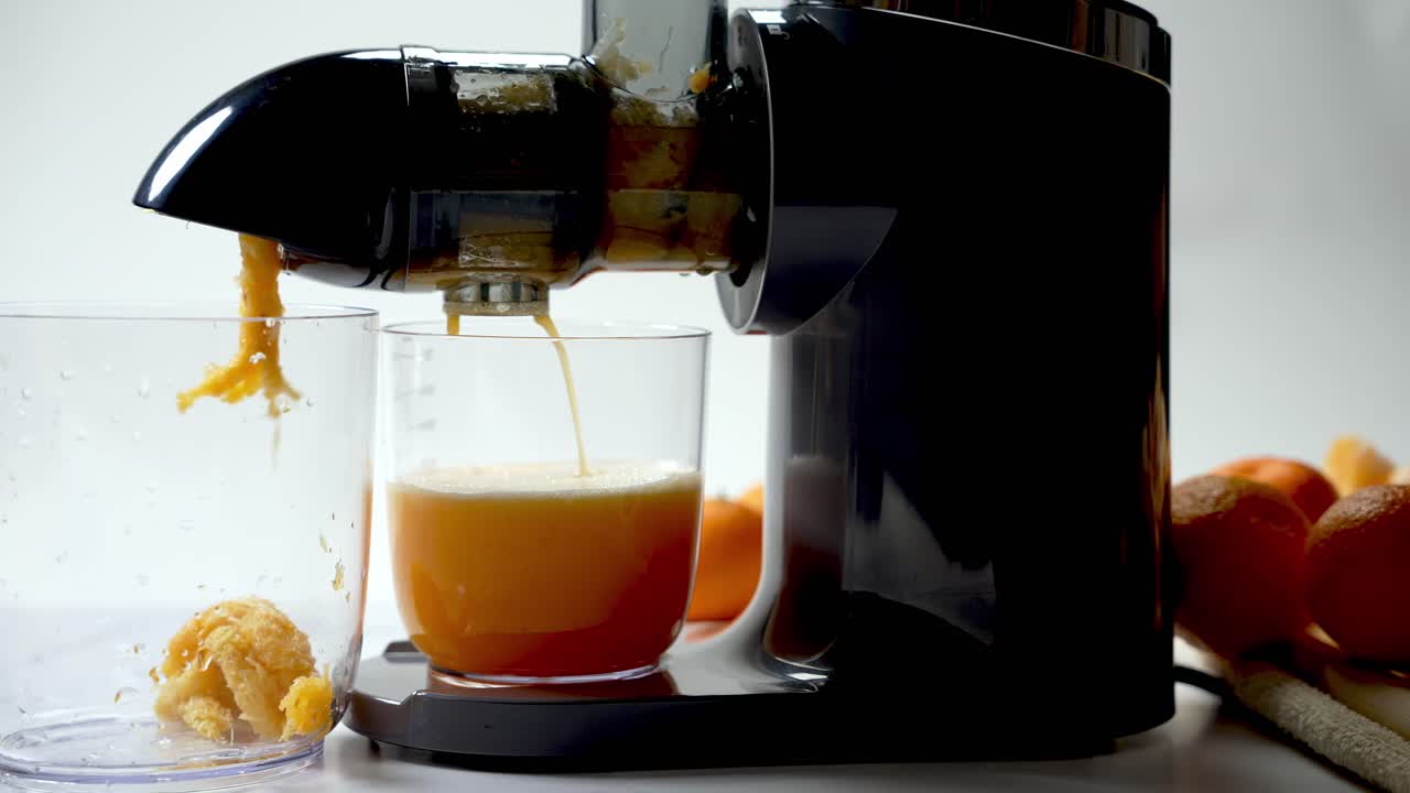 Fruity pulp extract, glass measuring container, delicious homemade drink