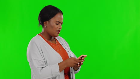 Typing,-phone-and-frustrated-woman-on-green-screen