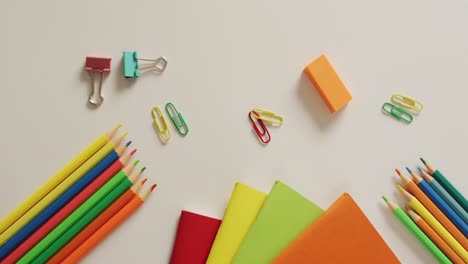 video of composition of school items on white surface