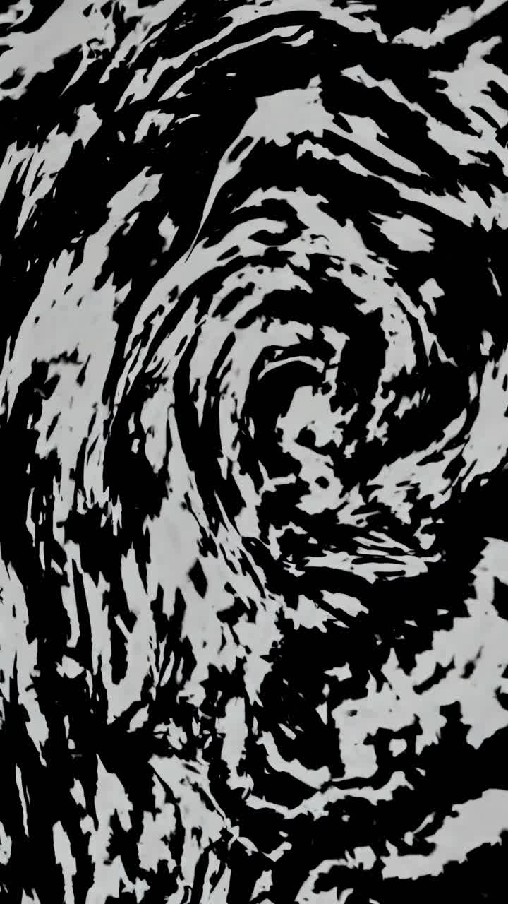 Motivo astratto a spirale in bianco e nero che ricorda un video ravvicinato di trame marmorizzate