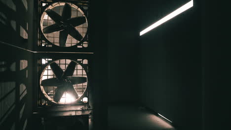 industrial ventilation fans in a dark room