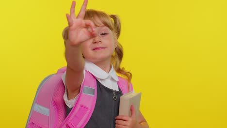 Smiling-schoolgirl,-looking-approvingly-at-camera-showing-ok-gesture,-like-sign-positive-good-reply