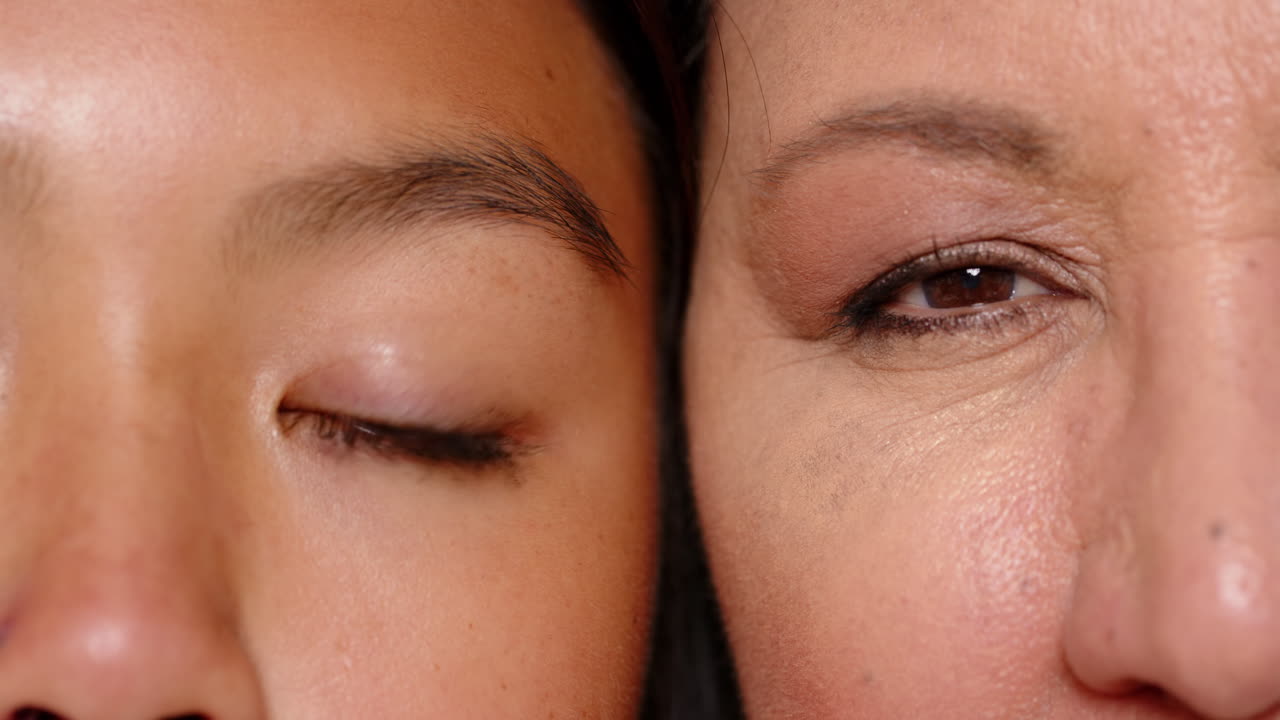 Close-up of multiracial grandmother and young woman, highlighting generational connection, at home