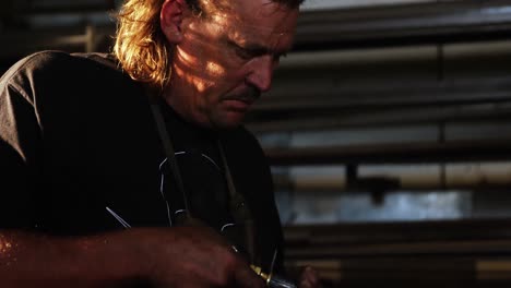 welder using welding torch