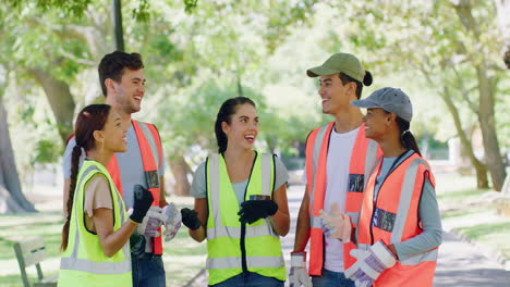 group of volunteers high five after cleaning