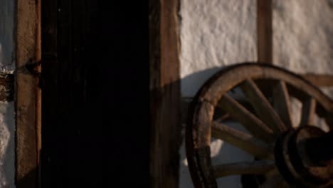 old-wood-wheel-and-black-door-at-white-house