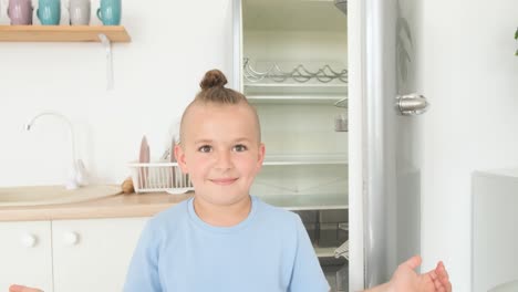 teenage boy opens the refrigerator in the kitchen teenage boy opens the refrigerator in the kitchen empty refrigerator shortage of food video