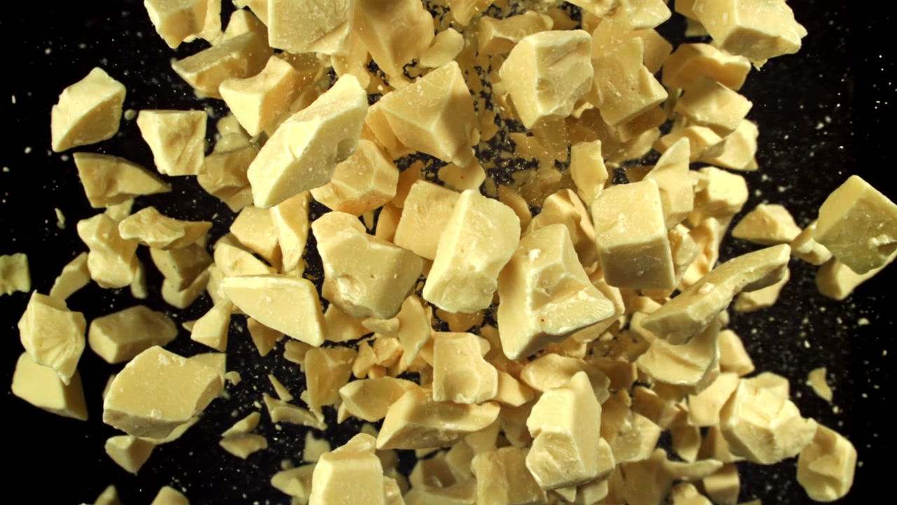 Delicious White Chocolate Chunks Falling in Slow Motion