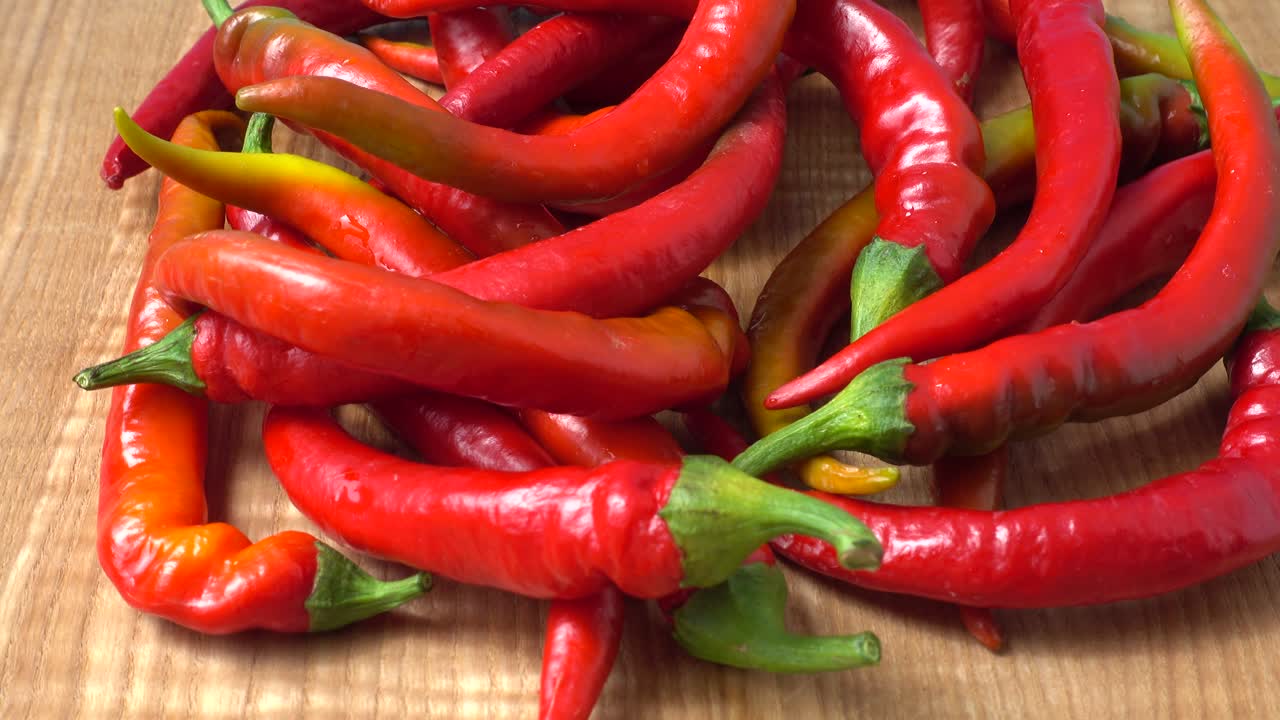 Red chilli, pepper. Shooting in the movement. Shooting in kitchen