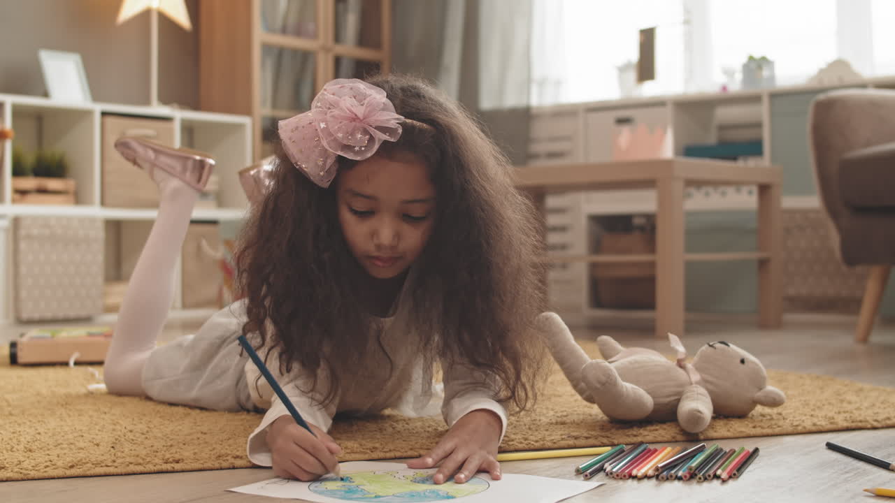 Girl Drawing while Friend Running Around