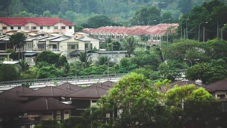 Residential-area-near-a-highway_car-crossing_bird-flying_morning-routine_off-to-work_long-shot_50fps