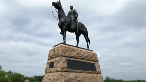 Tilt-up-reveals-General-Meade-on-horseback,-leader-of-Union-Army-during-Civil-War-at-Gettysburg-National-Military-Park-statue