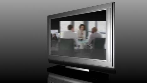 television screen showing business meetings