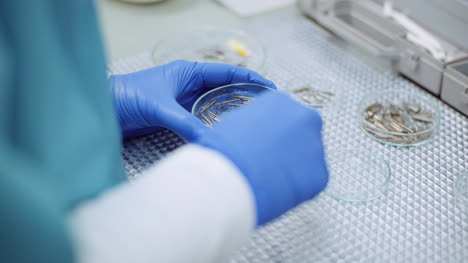 doctor sorts medical instruments at healthcare clinic 6