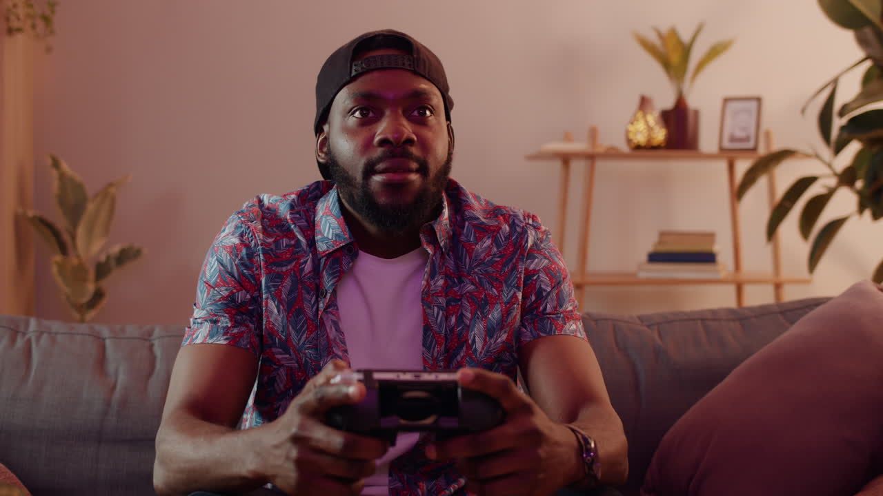 Man playing video games at home