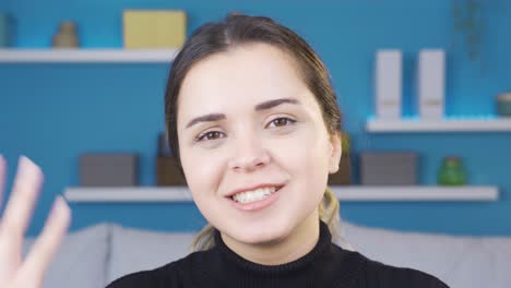 positive young woman talking to camera.