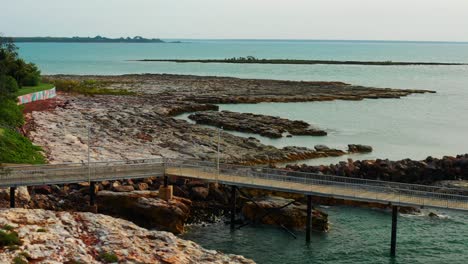 jetty at the nightcliff pier in darwin, northern territory of australia with rocky coast