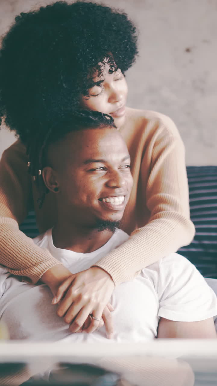 Young Black Couple Embracing Affectionately at Home