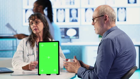 Vertical Video Senior man patient arriving at appointment with physician next to mockup
