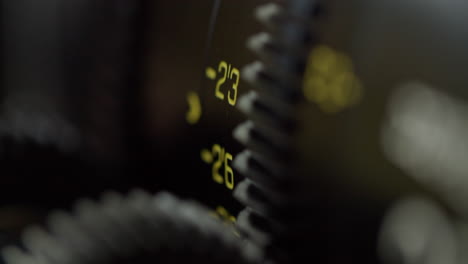 macro shot of the markings of a cinema lens, focus barrel moving, lens changing the focus