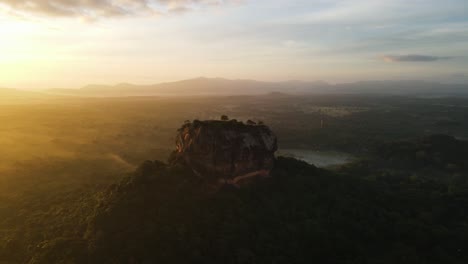 sunrise over sigiriya rock fortress in sri lanka aerial panoramic view. lions rock, sigiriya rock, sri lanka - aerial photograph of lion's rock