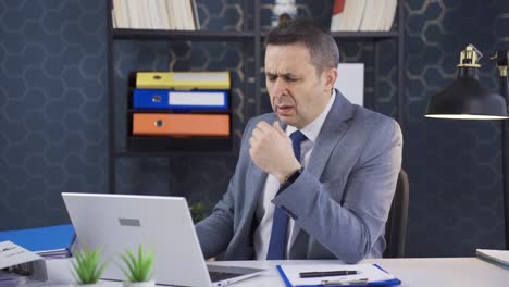 mature businessman working on laptop alone in office is shocked and disappointed by what he sees on screen.