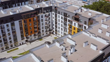 new residential complex. high-rise buildings built together. comfortable playground for kids surrounded by apartment buildings. top aerial view.