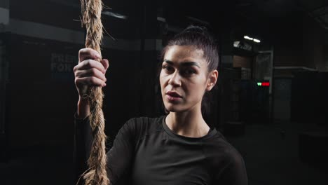 young woman posing in the gym during crossfit work-out