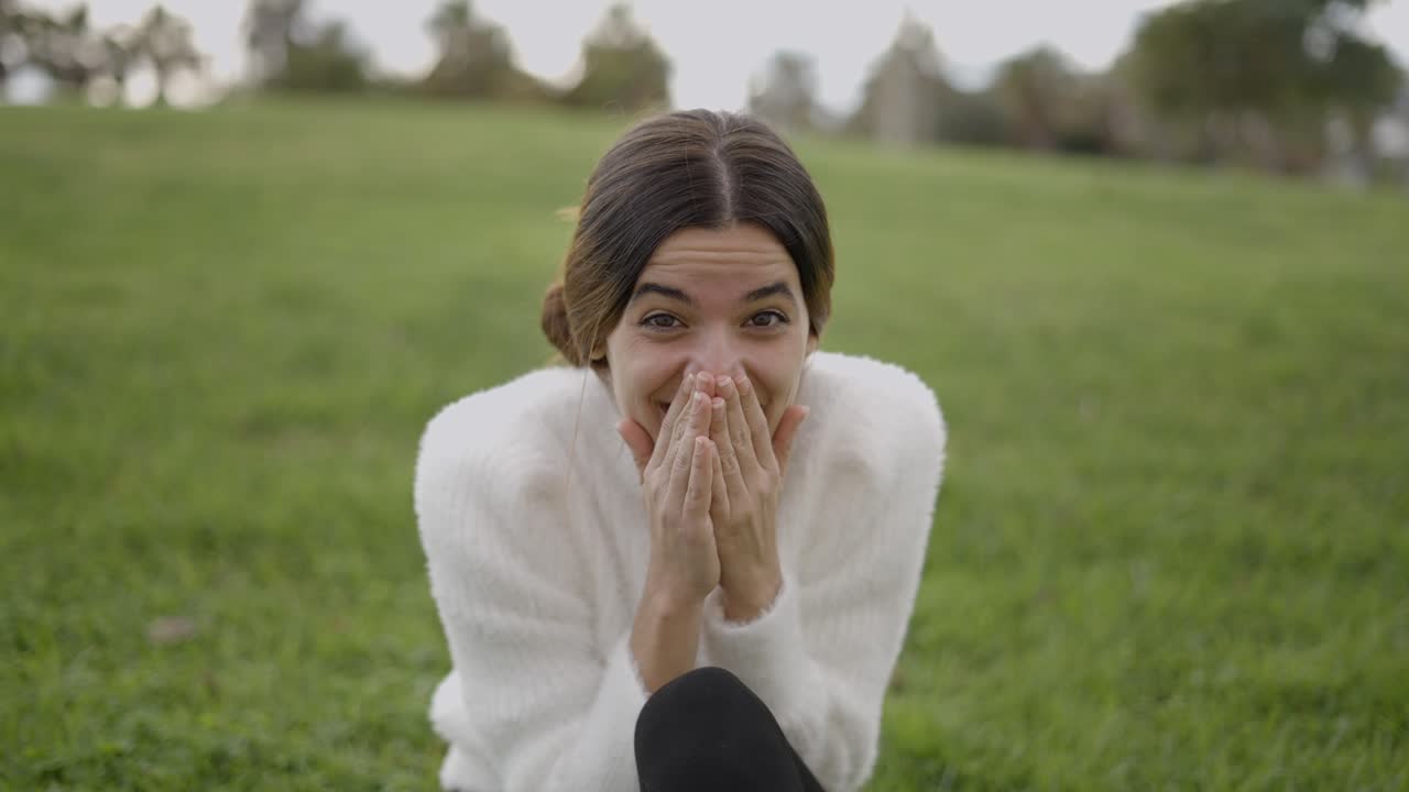 Woman laughing in a park