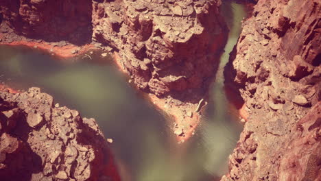 aerial view of a red rock canyon with a river