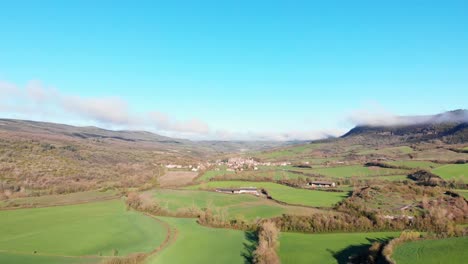 aerial view of a rural valley and village landscape