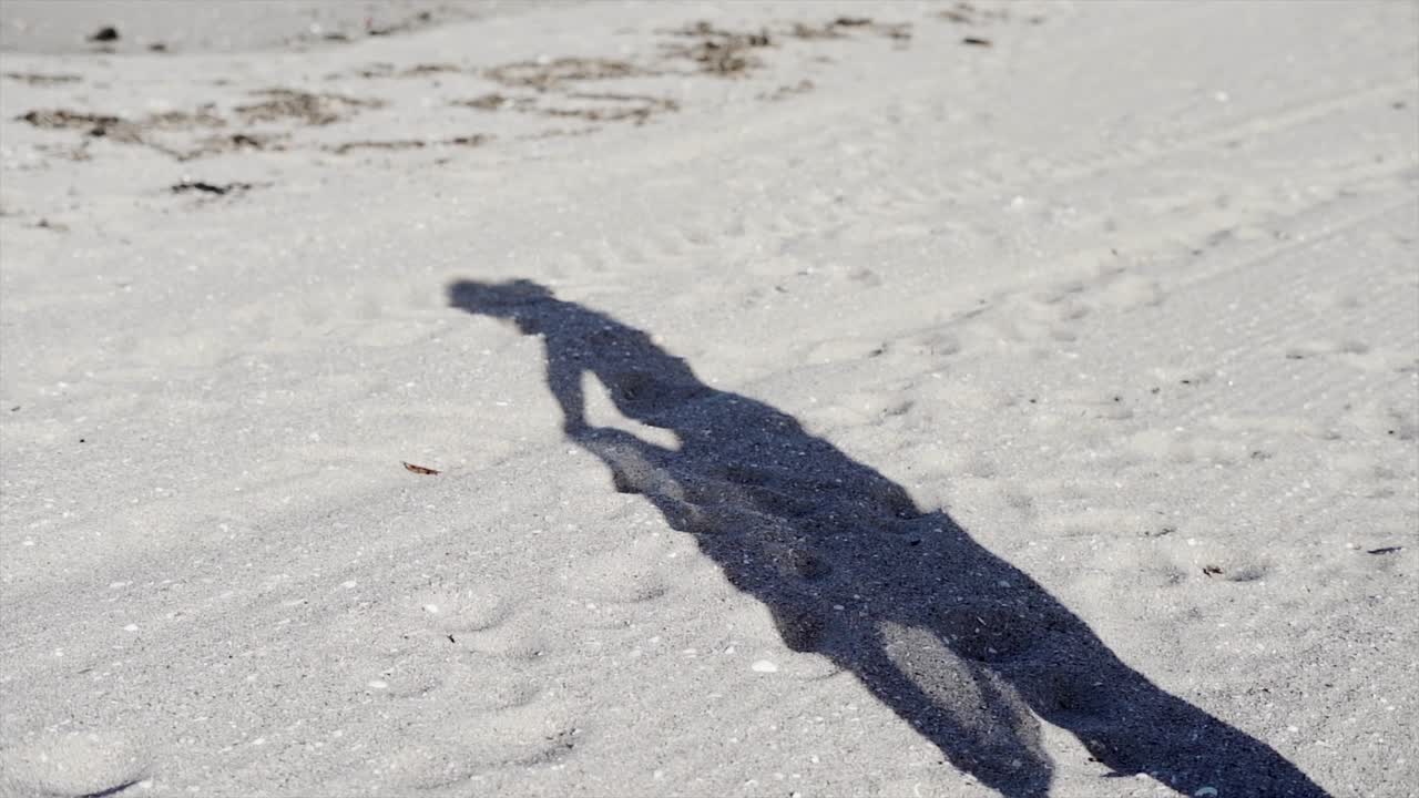 Shadow on a sandy beach