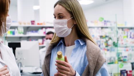 young women talking at the pharmacy