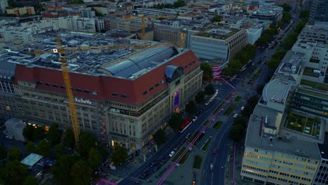 buttery soft aerial view flight panorama orbit drone of department store kadewe on wittenberg place in berlin germany at summer evening september 2022